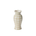 White ceramic vase with scalloped rim and grid pattern on a white background