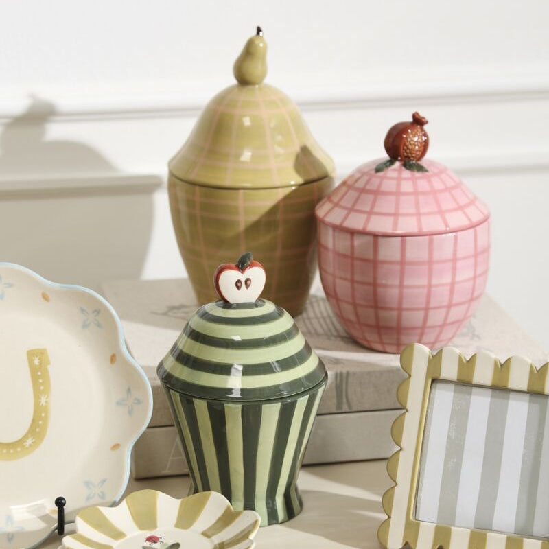 Decorative ceramic fruit canisters 