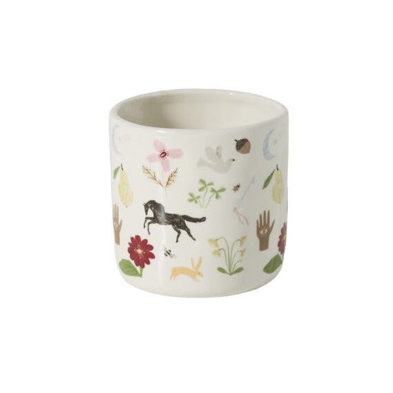 A ceramic planter on a white backdrop. The planter is white with a delicate multicolor floral, horse, fruit, flower and bird illustration pattern.