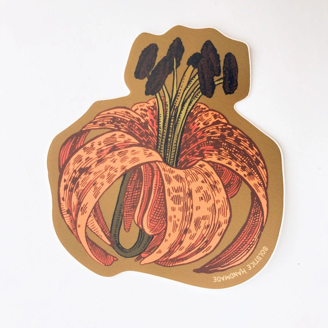 Sticker of a lily flower with a brown border on a white background