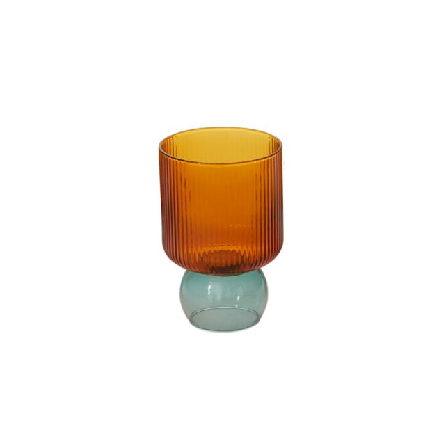 Two-toned glass vase with an orange top and greenish base on a white background