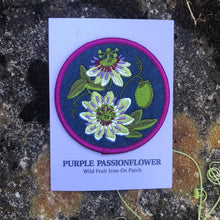 Load image into Gallery viewer, Embroidered patch of a purple passionflower on a card, placed on a textured stone surface.
